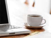 laptop computer and cup of coffee