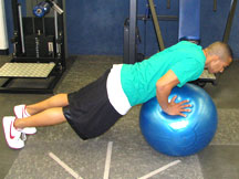 Lower body to position several inches above ball.