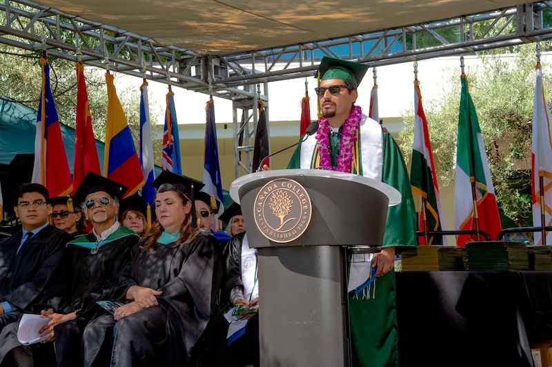 2025 student speaker, Oscar Arreola Buendia on stage giving his speech 