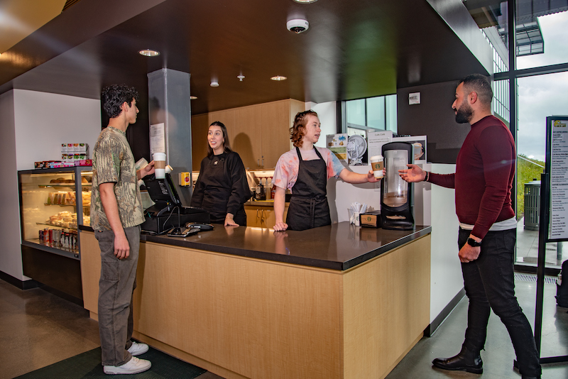 Students ordering drinks and food at the Colts Cafe